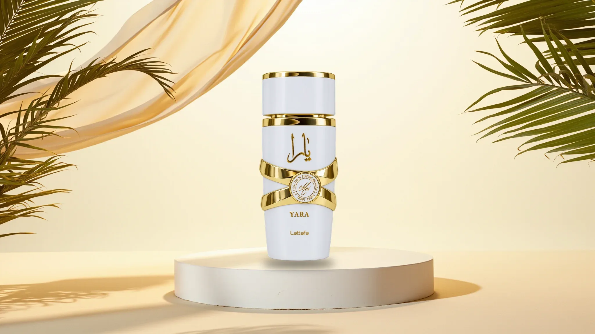 White and gold Yara perfume on a cream-coloured display